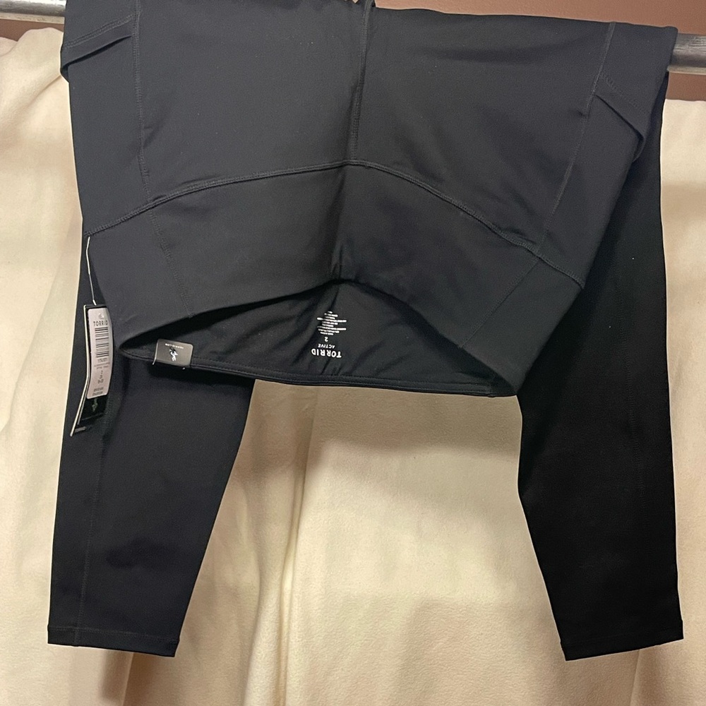 TORRID Active Size 2 nylon blend leggings. Black. New With Tags. Pockets.